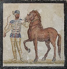 233px-Mosaic_blue_charioteer_Massimo